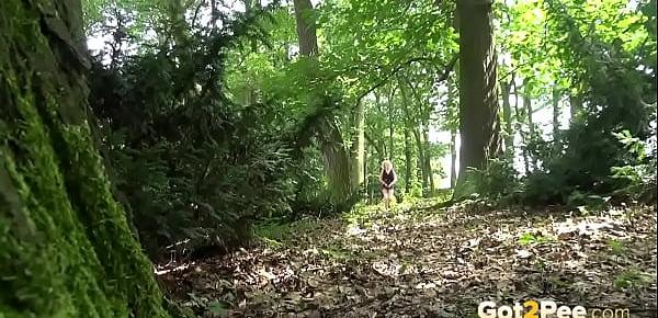  Blonde gushes piss while in the woods